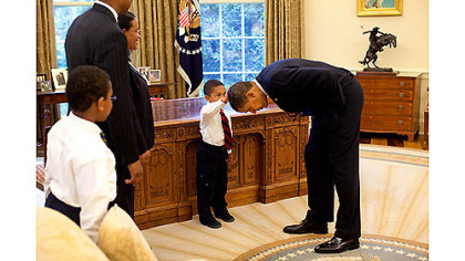 An indelible image of a pat on the President's head
